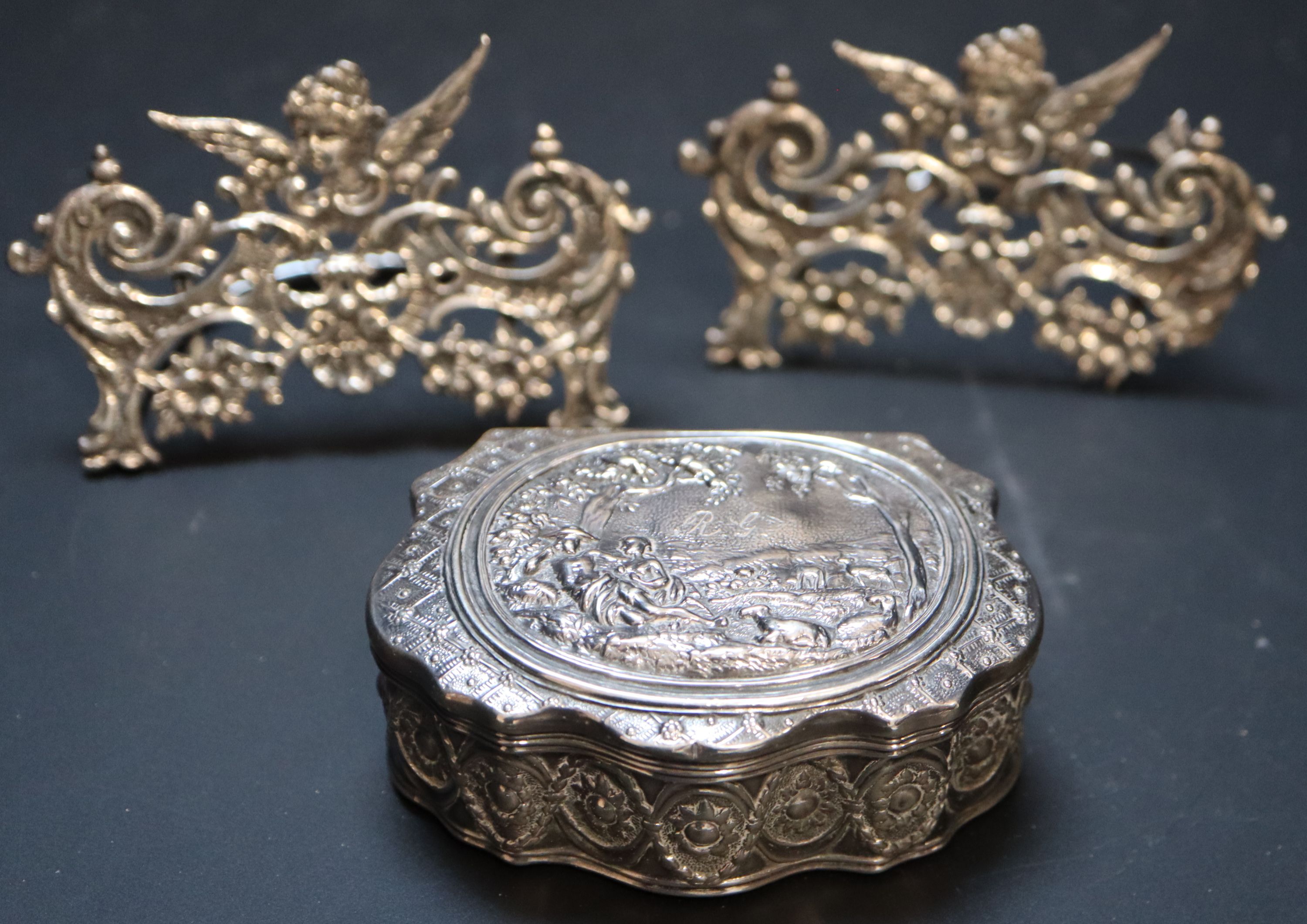 A pair of late Victorian pierced scroll silver menu holders,